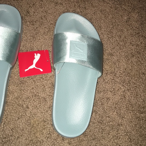light blue puma slides
